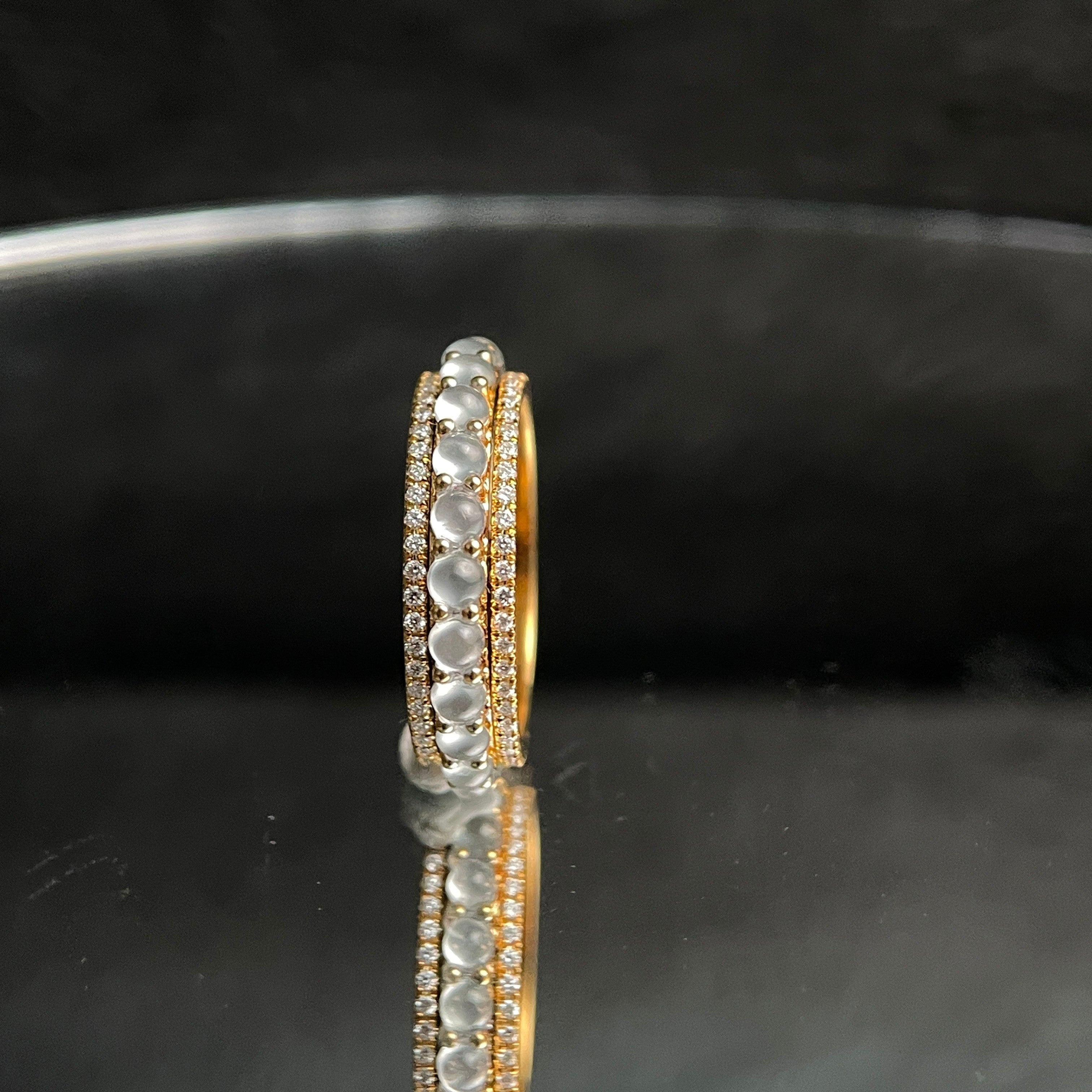 Sylvia Jewelry 18K gold ring with rotating white jadeite cabochons and diamond accents.