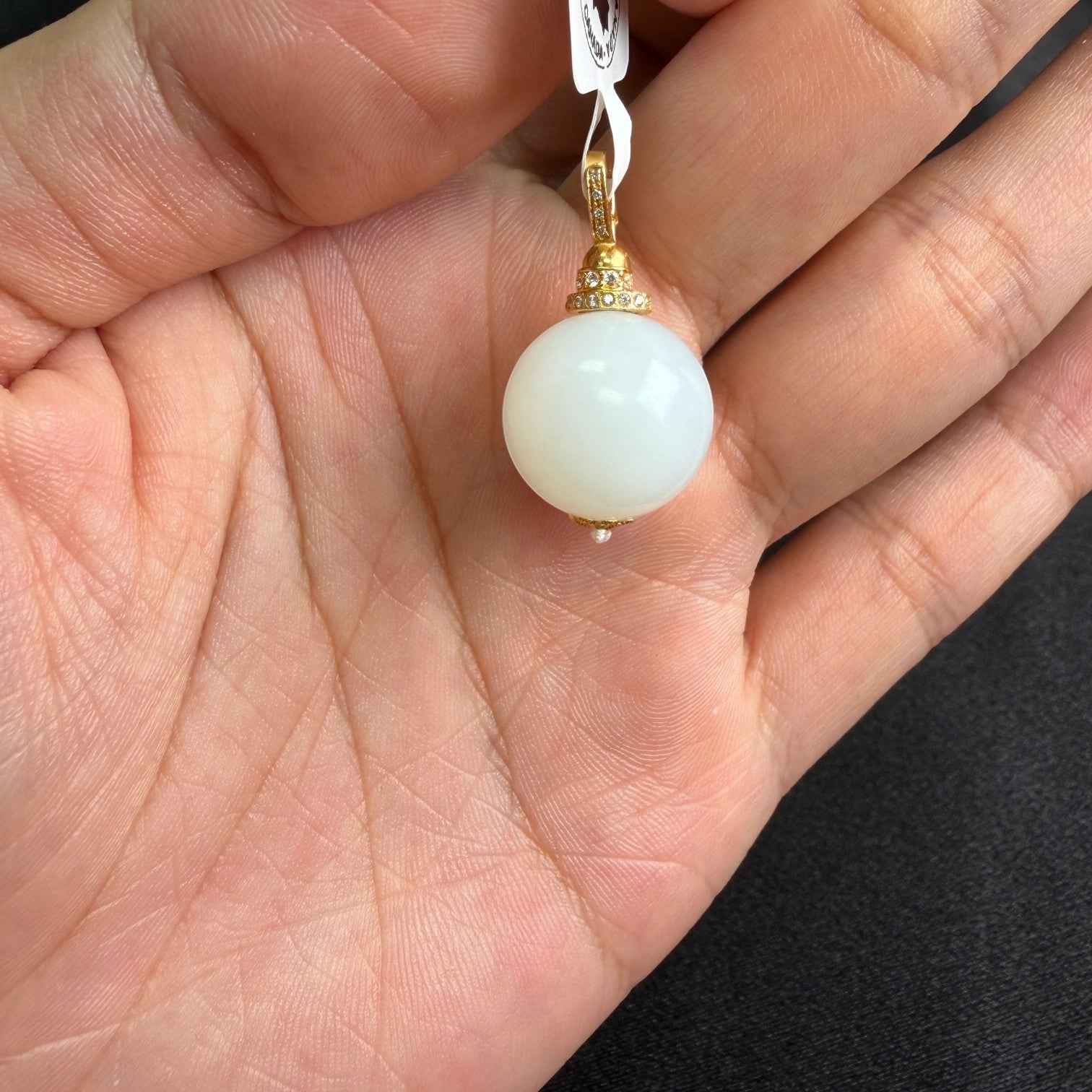 Sylvia Jewelry Celestial Sphere pendant featuring a white Hetian nephrite jade bead with 18k gold and micro-pavé diamonds.