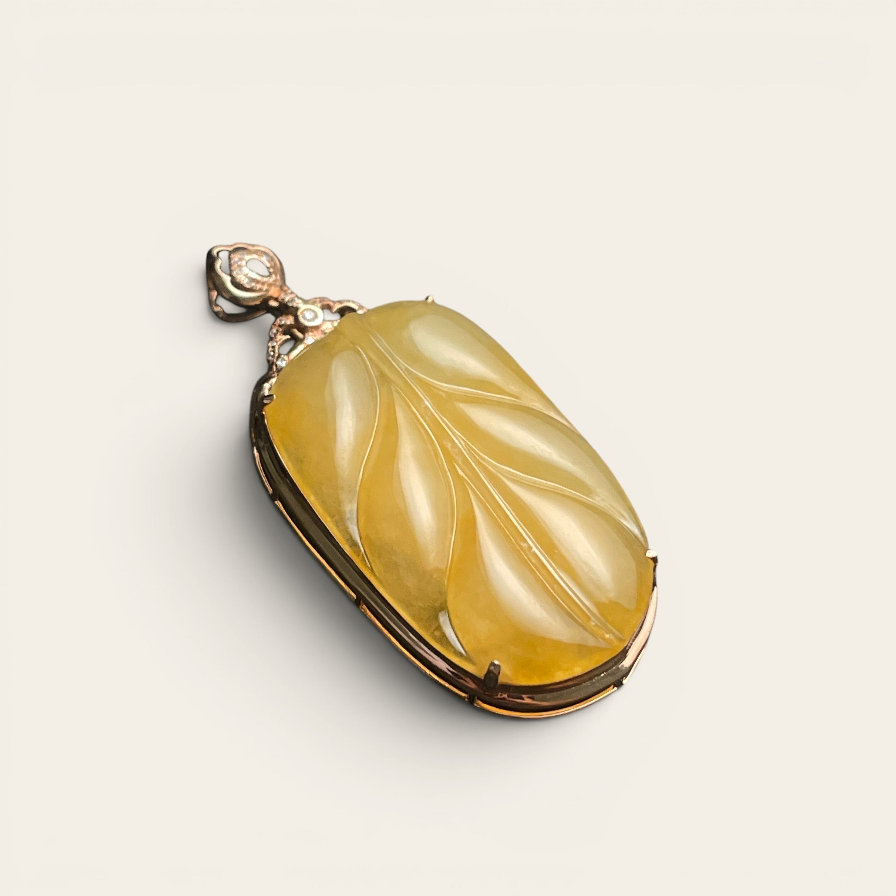 Sylvia Jewelry yellow jadeite leaf pendant carved in 18k rose gold with diamond accents and filigree bail.